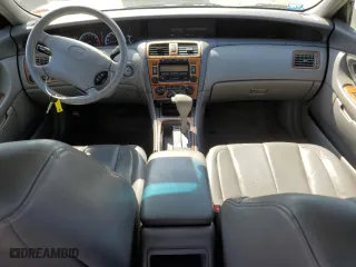2000 Toyota Avalon XL with VIN 4T1BF28B4YU048027, listed as a Copart auction lot 48817755 with 214,793 mi miles and Salvage Title. Bid and sale history available at carsss.com. Image 8.