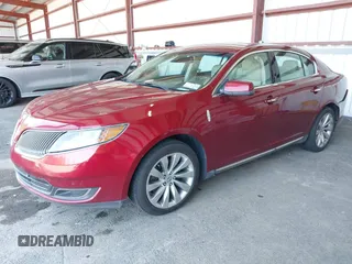 2014 Lincoln MKS z VIN 1LNHL9DK0EG606497, wystawiony jako IAAI lot #42279603 z przebiegiem 129 972 mil mil oraz . Historia ofert i sprzedaży dostępna na DreamBid. Obrazek 2.
