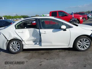 2024 Toyota Corolla Hybrid LE with VIN JTDBCMFE2RJ031865, listed as a IAAI auction lot 41602715 with 10,892 mi miles. Bid and sale history available at carsss.com. Image 13.