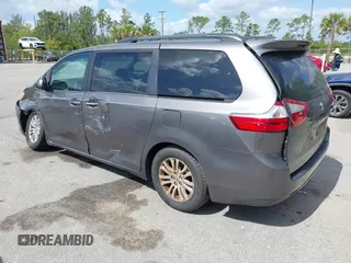 2015 Toyota Sienna XLE with VIN 5TDYK3DC3FS556859, listed as a IAAI auction lot 42161107 with 200,502 mi miles and . Bid and sale history available at DreamBid. Image 3.
