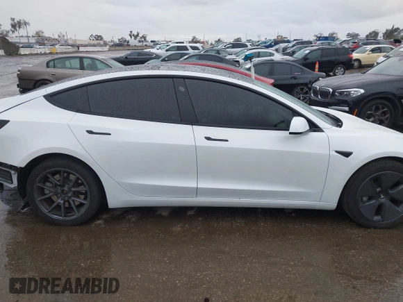 2023 Tesla Model 3 with VIN 5YJ3E1EA8PF578199, listed as a IAAI auction lot 41735465 with 50,823 mi miles and . Bid and sale history available at DreamBid. Image 13.