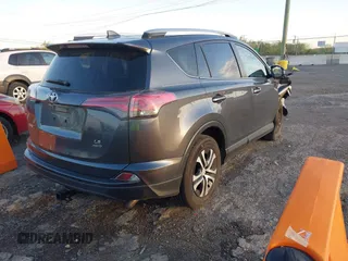 2016 Toyota RAV4 LE with VIN JTMBFREV1GD187414, listed as a IAAI auction lot 42033130 with 123,955 mi miles and . Bid and sale history available at carsss.com. Image 4.