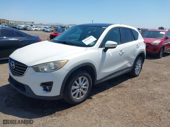 2016 Mazda CX-5 Touring with VIN JM3KE4CY7G0687952, listed as a IAAI auction lot 41976375 with 113,018 mi miles. Bid and sale history available at carsss.com. Image 17.