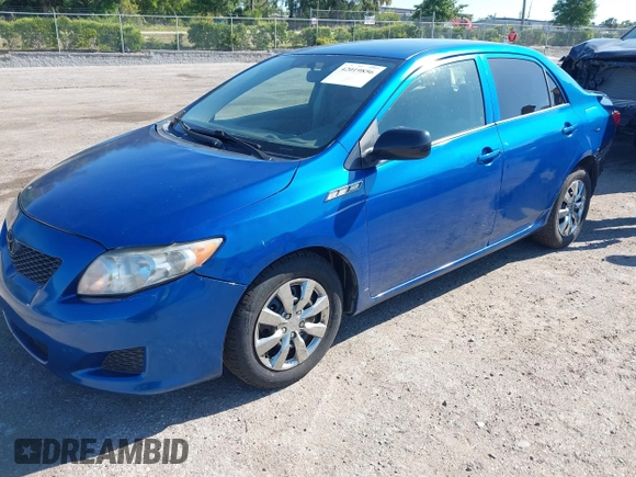 2009 Toyota Corolla with VIN JTDBL40E999021523, listed as a IAAI auction lot 42019856 with 194,011 mi miles. Bid and sale history available at carsss.com. Image 2.