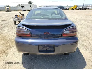 2000 Pontiac Grand Prix GT z VIN 1G2WP12K7YF189639, wystawiony jako Copart lot #57891595 z przebiegiem 70 055 mil mil oraz Tytuł czysty. Historia ofert i sprzedaży dostępna na DreamBid. Obrazek 6.