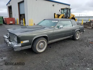 1984 Cadillac Eldorado z VIN 1G6AL5781EE619594, wystawiony jako Copart lot #80918934 z przebiegiem 47 529 mil mil oraz Szkody całkowita. Historia ofert i sprzedaży dostępna na DreamBid. Obrazek 1.