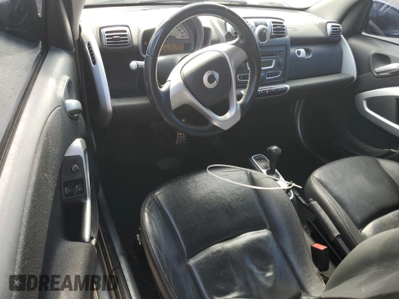 2009 Smart fortwo Pure z VIN WMEEJ31X89K276221, wystawiony jako Copart lot #57912565 z przebiegiem 118 701 mil mil oraz Szkody całkowita. Historia ofert i sprzedaży dostępna na DreamBid. Obrazek 8.