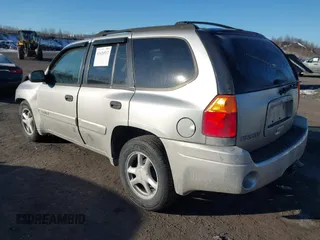 2005 GMC Envoy SLE with VIN 1GKDT13S452194933, listed as a IAAI auction lot 41426512 with 176,897 mi miles. Bid and sale history available at carsss.com. Image 3.