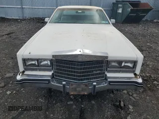 1985 Cadillac Eldorado z VIN 1G6EL578XFE673656, wystawiony jako Copart lot #86803334 z przebiegiem 94 396 mil mil oraz Tytuł czysty. Historia ofert i sprzedaży dostępna na DreamBid. Obrazek 11.