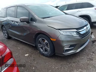 2019 Honda Odyssey Touring with VIN 5FNRL6H81KB038790, listed as a IAAI auction lot 42200190 with 131,761 mi miles and . Bid and sale history available at DreamBid. Image 1.