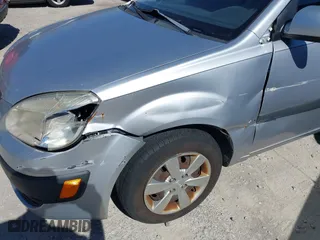 2008 Kia Rio LX with VIN KNADE123X86329097, listed as a IAAI auction lot 41822420 with 180,462 mi miles. Bid and sale history available at carsss.com. Image 6.