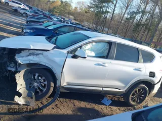 2019 Hyundai Santa Fe SE with VIN 5NMS2CAD6KH114027, listed as a IAAI auction lot 41874556 with 125,729 mi miles. Bid and sale history available at carsss.com. Image 14.