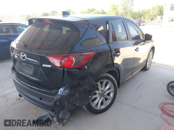 2015 Mazda CX-5 Grand Touring with VIN JM3KE4DY7F0481883, listed as a IAAI auction lot 42091709 with 184,248 mi miles and . Bid and sale history available at DreamBid. Image 6.
