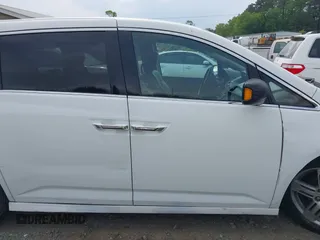 2011 Honda Odyssey Touring with VIN 5FNRL5H90BB066177, listed as a IAAI auction lot 42053368 with 239,205 mi miles and . Bid and sale history available at carsss.com. Image 13.