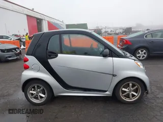 2015 Smart fortwo Passion with VIN WMEEJ3BA9FK819985, listed as a IAAI auction lot 41879486 with 79,394 mi miles. Bid and sale history available at carsss.com. Image 13.