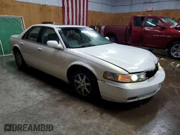 2004 Cadillac Seville Luxury SLS z VIN 1G6KS54Y24U168062, wystawiony jako Copart lot #84865574 z przebiegiem 240 052 mil mil oraz Tytuł czysty. Historia ofert i sprzedaży dostępna na DreamBid. Obrazek 4.