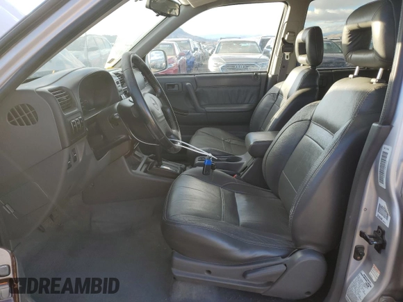 1999 Isuzu Rodeo S z VIN 4S2CM58W8X4339006, wystawiony jako Copart lot #84285294 z przebiegiem 129 191 mil mil oraz Czysty tytuł • Clean title. Historia ofert i sprzedaży dostępna na DreamBid. Obrazek 7.
