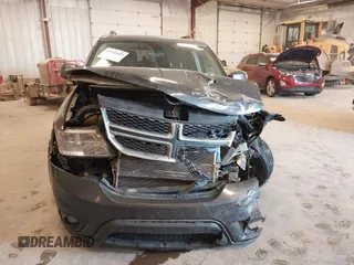 2017 Dodge Journey SXT z VIN 3C4PDCBGXHT534121, wystawiony jako IAAI lot #42145689 z przebiegiem 201 527 mil mil oraz . Historia ofert i sprzedaży dostępna na DreamBid. Obrazek 12.