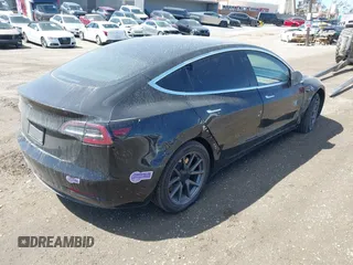 2019 Tesla Model 3 Mid Range with VIN 5YJ3E1EA3KF325056, listed as a IAAI auction lot 41771543 with 183,157 mi miles and . Bid and sale history available at carsss.com. Image 4.