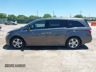 2012 Honda Odyssey Touring with VIN 5FNRL5H93CB109394, listed as a IAAI auction lot 42280018 with 190,412 mi miles and . Bid and sale history available at DreamBid. Image 14.