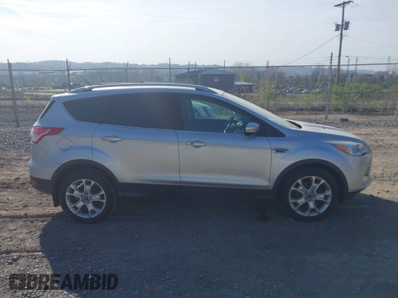 2016 Ford Escape Titanium with VIN 1FMCU9JX2GUA50916, listed as a IAAI auction lot 42118711 with 121,405 mi miles. Bid and sale history available at carsss.com. Image 14.