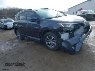 2016 Toyota RAV4 Hybrid XLE with VIN JTMRJREV7GD005129, listed as a IAAI auction lot 41096612 with 107,857 mi miles. Bid and sale history available at carsss.com. Image 1.