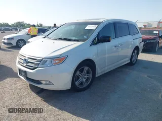 2012 Honda Odyssey Touring with VIN 5FNRL5H93CB125241, listed as a IAAI auction lot 42299053 with 125,549 mi miles and . Bid and sale history available at DreamBid. Image 2.