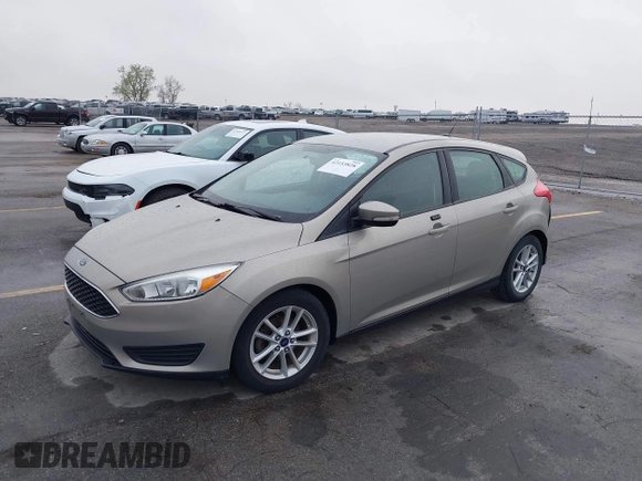 2015 Ford Focus SE with VIN 1FADP3K21FL211511, listed as a IAAI auction lot 42153828 with 126,111 mi miles. Bid and sale history available at carsss.com. Image 2.