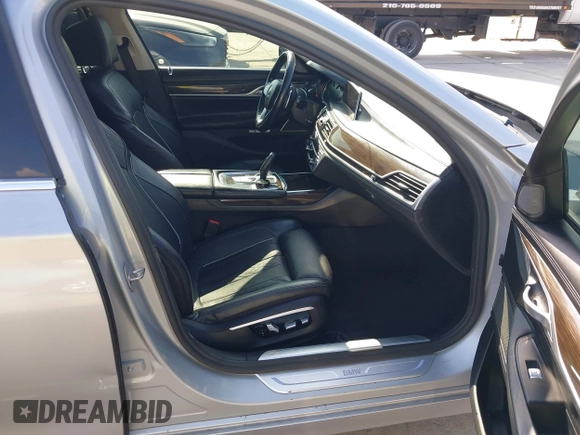 2016 BMW 7 Series 740i with VIN WBA7E2C5XGG739099, listed as a IAAI auction lot 41526038 with 123,900 mi miles. Bid and sale history available at carsss.com. Image 5.