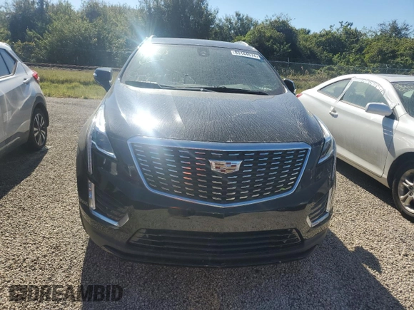 2022 Cadillac XT5 FWD Luxury z VIN 1GYKNAR47NZ100986, wystawiony jako Copart lot #83144574 z przebiegiem Nie podano mil oraz Nie do naprawy • Non repairable. Historia ofert i sprzedaży dostępna na DreamBid. Obrazek 5.