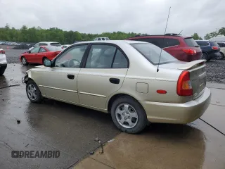 2002 Hyundai Accent GL z VIN KMHCG45C12U355561, wystawiony jako Copart lot #54546945 z przebiegiem 22 893 mil mil oraz Szkody całkowita. Historia ofert i sprzedaży dostępna na DreamBid. Obrazek 2.