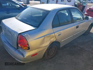 2004 Hyundai Accent GL with VIN KMHCG45C14U547954, listed as a IAAI auction lot 41350219 with 138,436 mi miles. Bid and sale history available at carsss.com. Image 4.