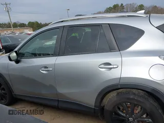2016 Mazda CX-5 Grand Touring with VIN JM3KE4DY1G0616714, listed as a IAAI auction lot 41459781 with 90,763 mi miles. Bid and sale history available at carsss.com. Image 14.