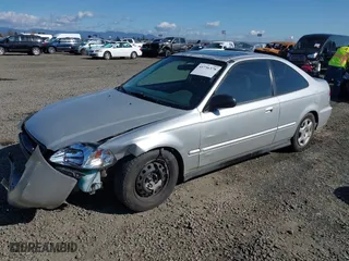 1999 Honda Civic EX with VIN 1HGEJ8242XL025414, listed as a IAAI auction lot 41736378 with 206,342 mi miles. Bid and sale history available at carsss.com. Image 2.