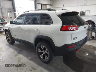 2017 Jeep Cherokee Trailhawk with VIN 1C4PJMBS5HW614956, listed as a IAAI auction lot 42079991 with 143,378 mi miles and . Bid and sale history available at DreamBid. Image 3.