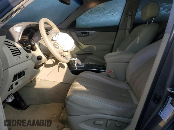 2014 Infiniti QX70 z VIN JN8CS1MW5EM412429, wystawiony jako Copart lot #82933934 z przebiegiem Nie podano mil oraz Szkoda całkowita • Salvage title. Historia ofert i sprzedaży dostępna na DreamBid. Obrazek 7.