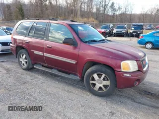 2004 GMC Envoy SLE with VIN 1GKDS13S342287315, listed as a IAAI auction lot 41486715 with 186,129 mi miles. Bid and sale history available at carsss.com. Image 1.