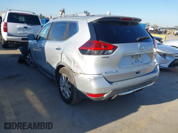 2019 Nissan Rogue SV with VIN JN8AT2MT9KW263622, listed as a IAAI auction lot 42021454 with 60,825 mi miles. Bid and sale history available at carsss.com. Image 3.