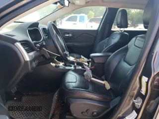 2014 Jeep Cherokee Trailhawk with VIN 1C4PJMBS1EW304718, listed as a Copart auction lot 64105485 with 151,315 mi miles and Salvage title. Bid and sale history available at DreamBid. Image 7.