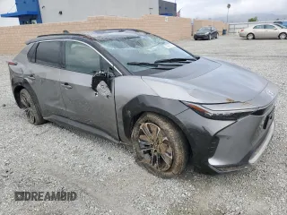 2024 Toyota bZ4X XLE with VIN JTMAAAAA8RA045760, listed as a Copart auction lot 50996385 with 3,833 mi miles and Salvage Title. Bid and sale history available at DreamBid. Image 4.