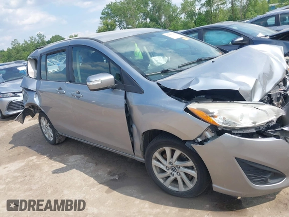 2014 Mazda 5 Sport with VIN JM1CW2BL6E0164195, listed as a IAAI auction lot 42455158 with 155,007 mi miles and . Bid and sale history available at DreamBid. Image 14.
