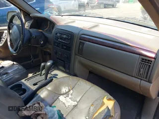 2000 Jeep Grand Cherokee Laredo with VIN 1J4GW48S8YC380039, listed as a IAAI auction lot 42510307 with 215,776 mi miles and . Bid and sale history available at DreamBid. Image 5.