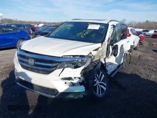 2017 Honda Pilot Touring with VIN 5FNYF6H98HB102313, listed as a IAAI auction lot 41244311 with 106,931 mi miles. Bid and sale history available at carsss.com. Image 2.