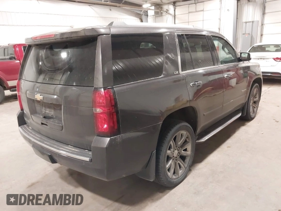 2016 Chevrolet Tahoe LTZ with VIN 1GNSKCKC1GR201155, listed as a IAAI auction lot 42235228 with 184,585 mi miles and . Bid and sale history available at DreamBid. Image 4.