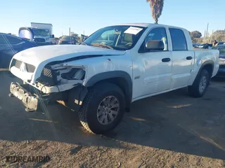 2006 Mitsubishi Raider Duro Cross with VIN 1Z7HC38K36S576409, listed as a IAAI auction lot 41410982 with 152476 miles. Bid and sale history available at carsss.com. Image 19.