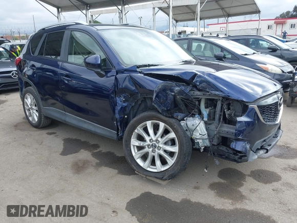 2014 Mazda CX-5 Grand Touring with VIN JM3KE2DY1E0307911, listed as a IAAI auction lot 42064898 with 133,934 mi miles. Bid and sale history available at carsss.com. Image 1.