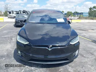 2017 Tesla Model X 90D with VIN 5YJXCBE21HF054898, listed as a IAAI auction lot 42076462 with 89,996 mi miles and . Bid and sale history available at DreamBid. Image 6.