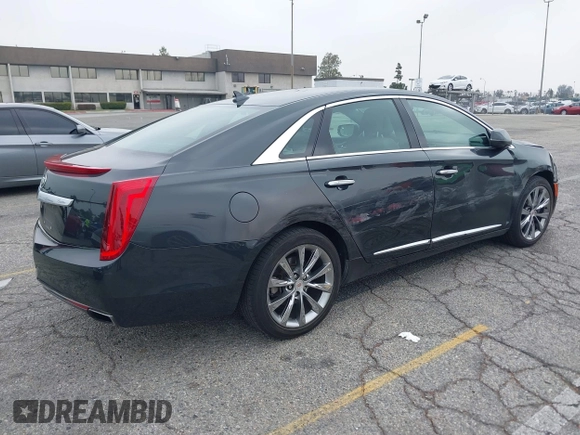 2013 Cadillac XTS Luxury with VIN 2G61P5S33D9215214, listed as a IAAI auction lot 42170402 with 132,045 mi miles and . Bid and sale history available at DreamBid. Image 4.