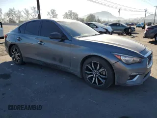 2019 Infiniti Q50 Luxe with VIN JN1EV7AP8KM514379, listed as a Copart auction lot 46948985 with 103,756 mi miles and Salvage title. Bid and sale history available at DreamBid. Image 4.
