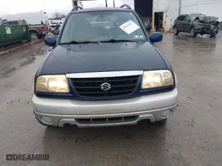2003 Suzuki Grand Vitara with VIN JS3TD62V134105917, listed as a IAAI auction lot 41415963 with 87,548 mi miles. Bid and sale history available at carsss.com. Image 6.